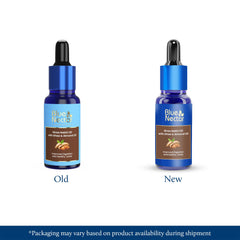 Blue Nectar Nabhi Oil dropper pour demonstrates precise application for belly care.