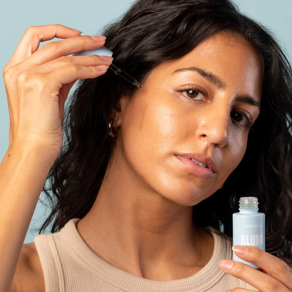 Blume Meltdown on face shows easy application and spot treatment capability.