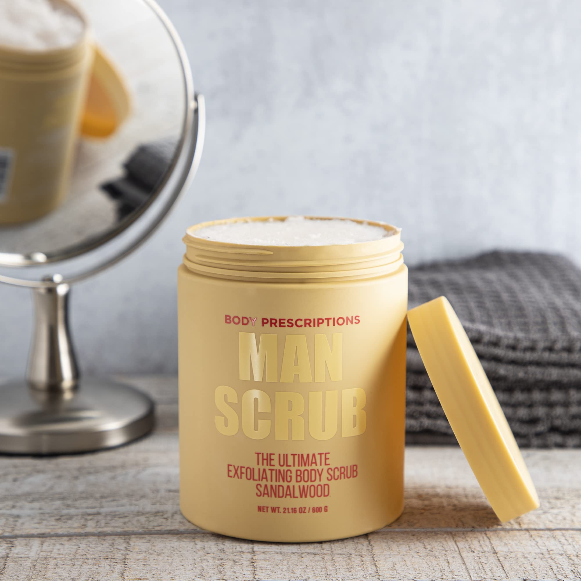 Body Prescriptions Men's Exfoliating Scrub in shower bottle demonstrates full-body cleansing for nourished skin
