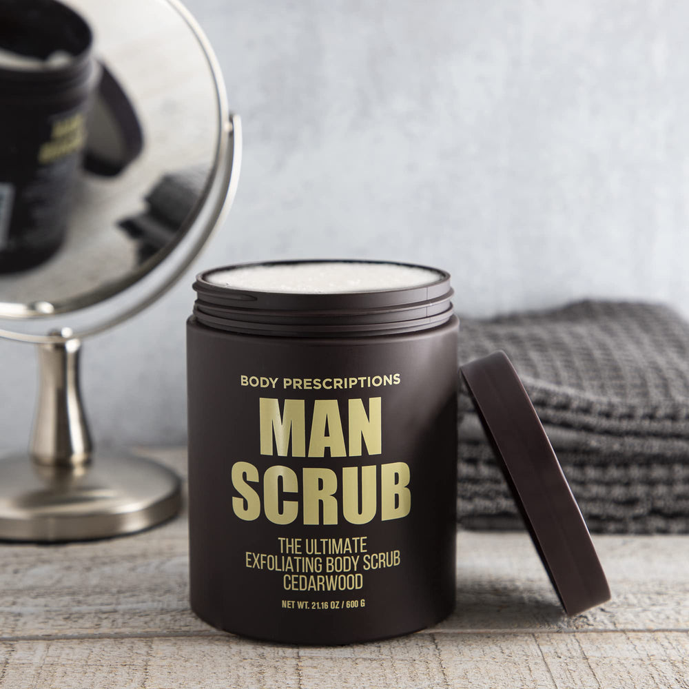 Body Prescriptions Exfoliating Scrub texture closeup shows gritty particles for skin renewal.