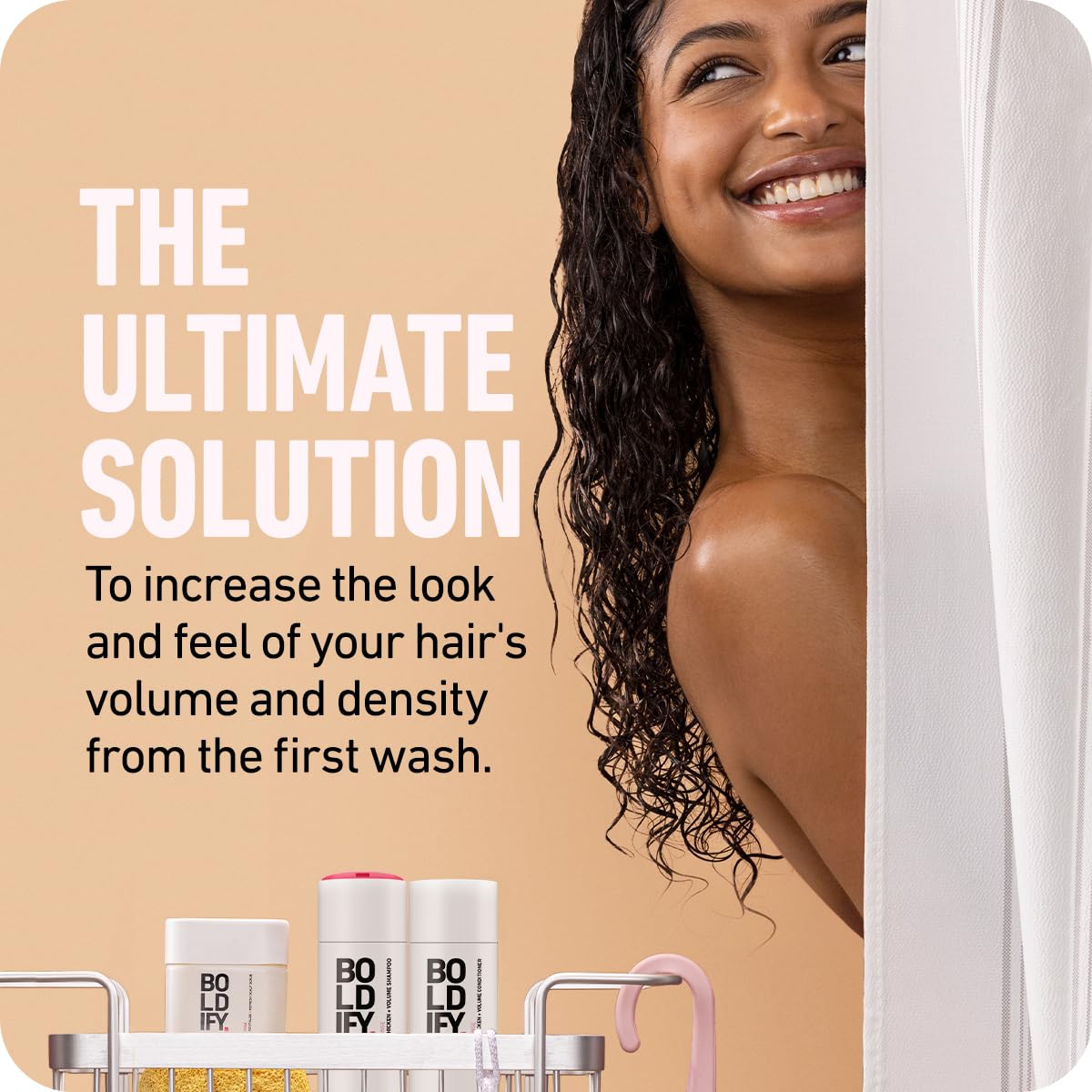Boldify Thicken Volume Conditioner being applied suggests detangling and smooth hair.
