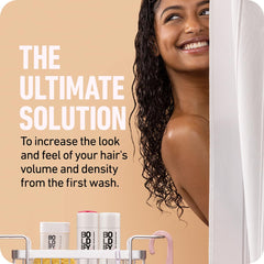Boldify Thicken Volume Conditioner being applied suggests detangling and smooth hair.