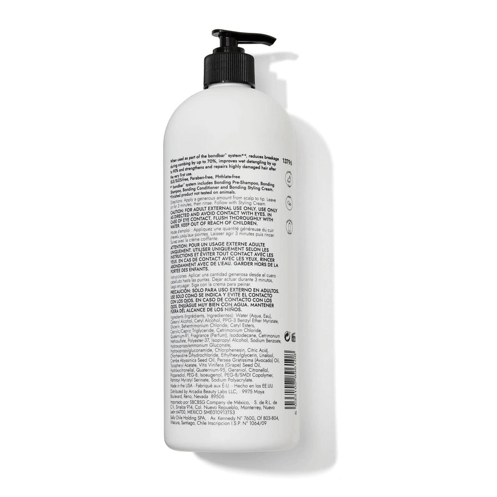 Bondbar conditioner being applied to hair mid-length for detangling and shine.