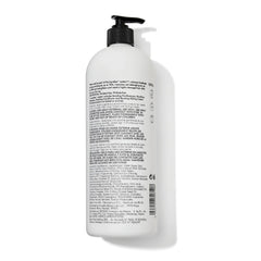 Bondbar conditioner being applied to hair mid-length for detangling and shine.