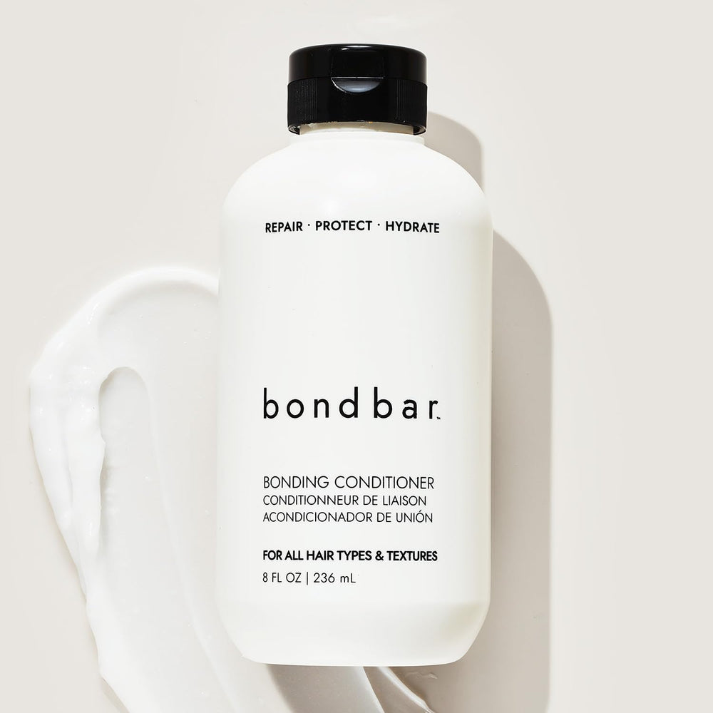 Close-up of glossy Bondbar-treated hair with smooth finish.