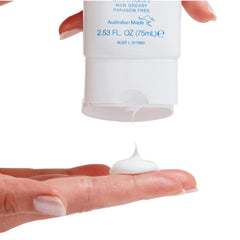 Bondi Sands fragrance free daily sunscreen being applied to the face for quick absorption.