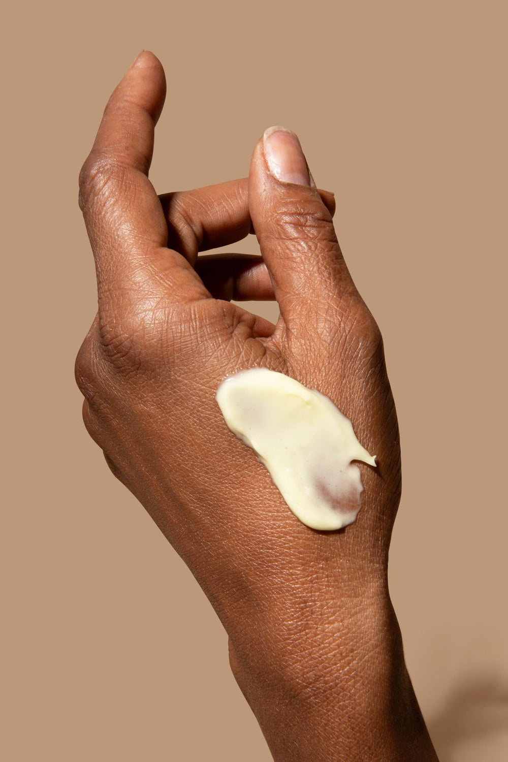 Boomsilk application routine with hands applying to face.