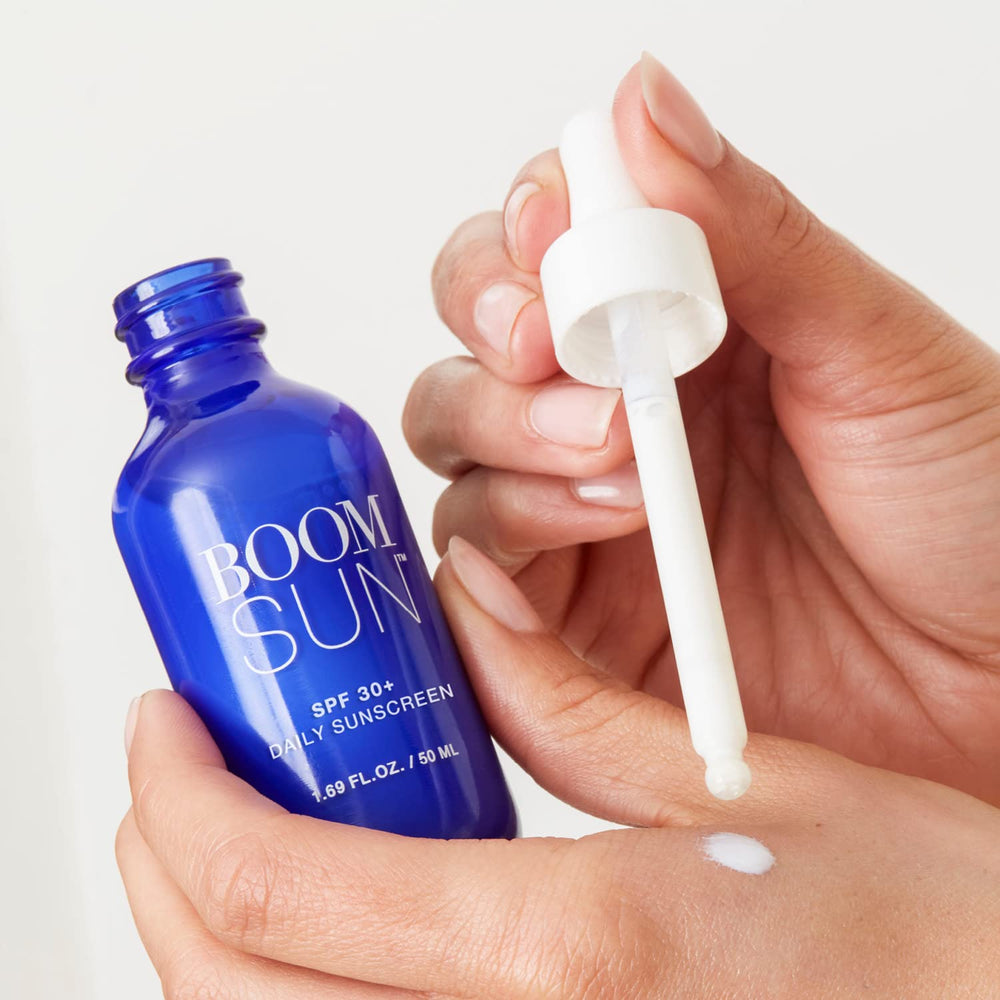 BOOM! Sun in hand demonstrates smooth application for gentle mineral protection.