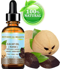 Pouring Botanical Beauty CACAY oil for hair hydration.