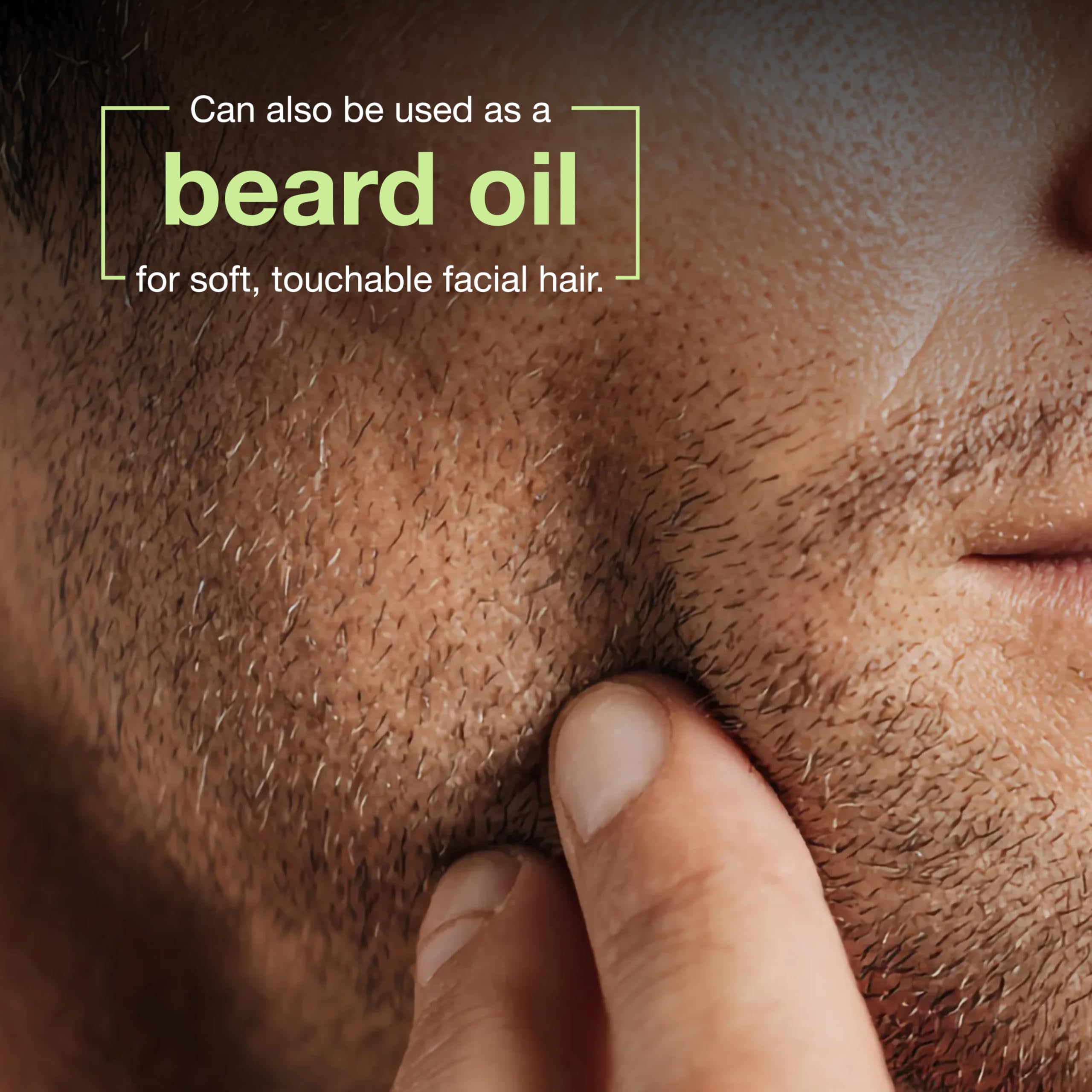 Botanics facial oil for men being applied to beard to condition facial hair.