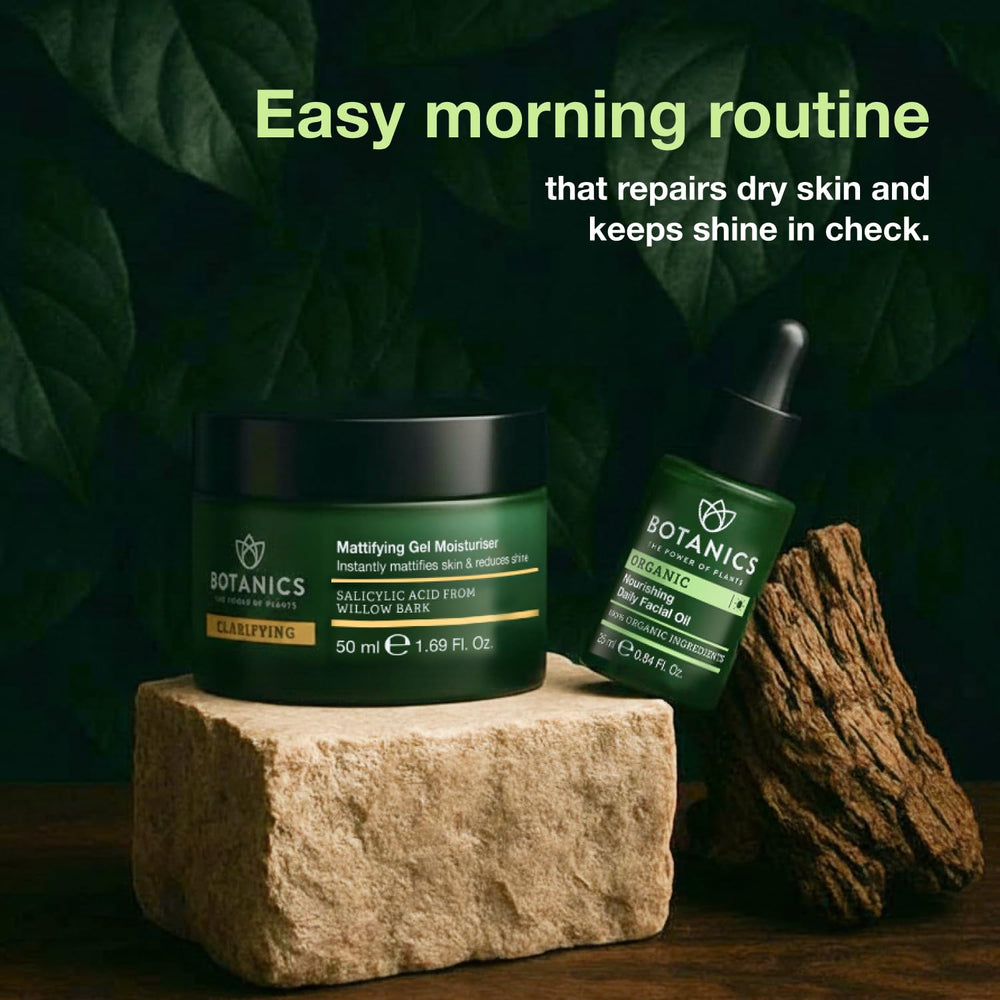 Botanics facial oil for men packaging shown on a counter for portability.