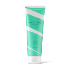 Bouclème Scalp Exfoliating Shampoo bottle ready for a spa-like cleanse for vibrant curls.