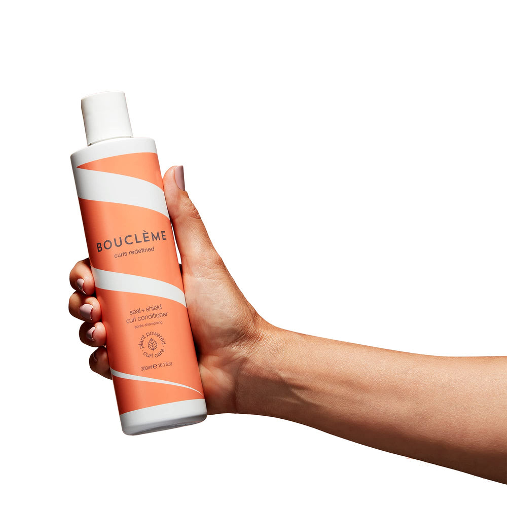 Bouclème Seal + Shield conditioner pump dispensing evenly for smooth styling.