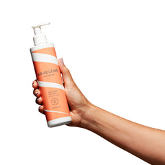 Applying Bouclème Seal and Shield to damp curls boosts definition.
