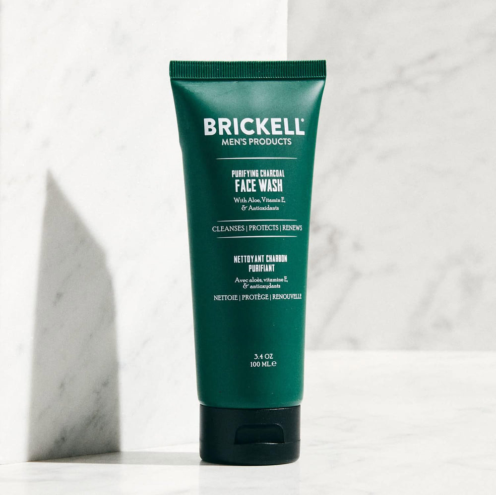 Brickell Men's Purifying Charcoal Face Wash charcoal texture close-up highlights natural cleansing formula.
