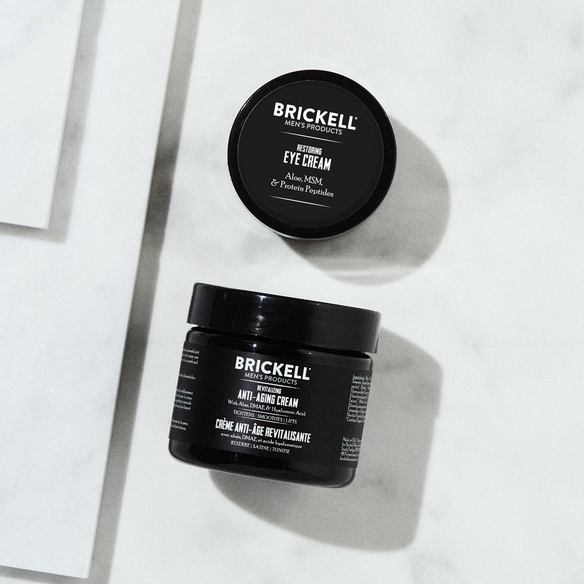 Brickell Men's Ultimate Anti-Aging Eye Cream tube with precise applicator for under-eye care.
