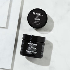 Brickell Men's Ultimate Anti-Aging Eye Cream tube with precise applicator for under-eye care.