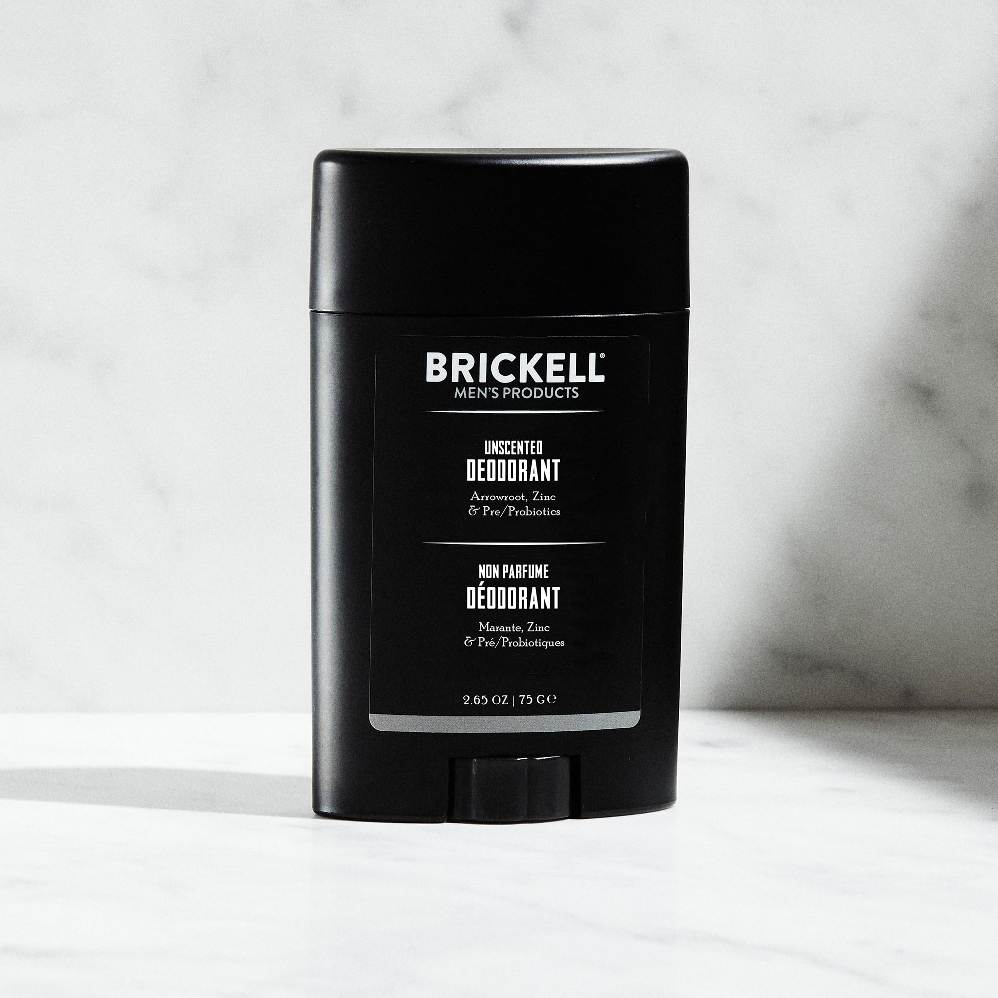 Brickell natural deodorant unscented stick being applied for smooth skin protection