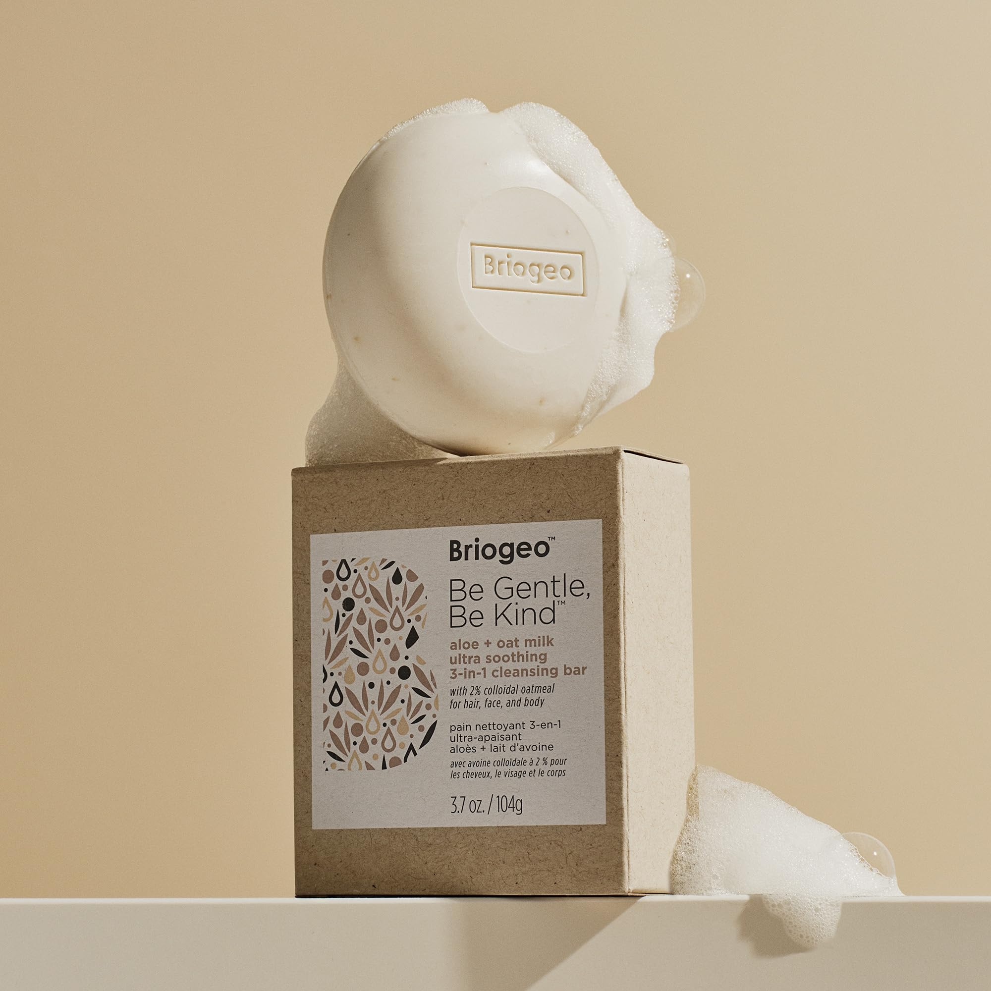 Briogeo Be Gentle Be Kind travel-friendly cleansing bar on travel setup.