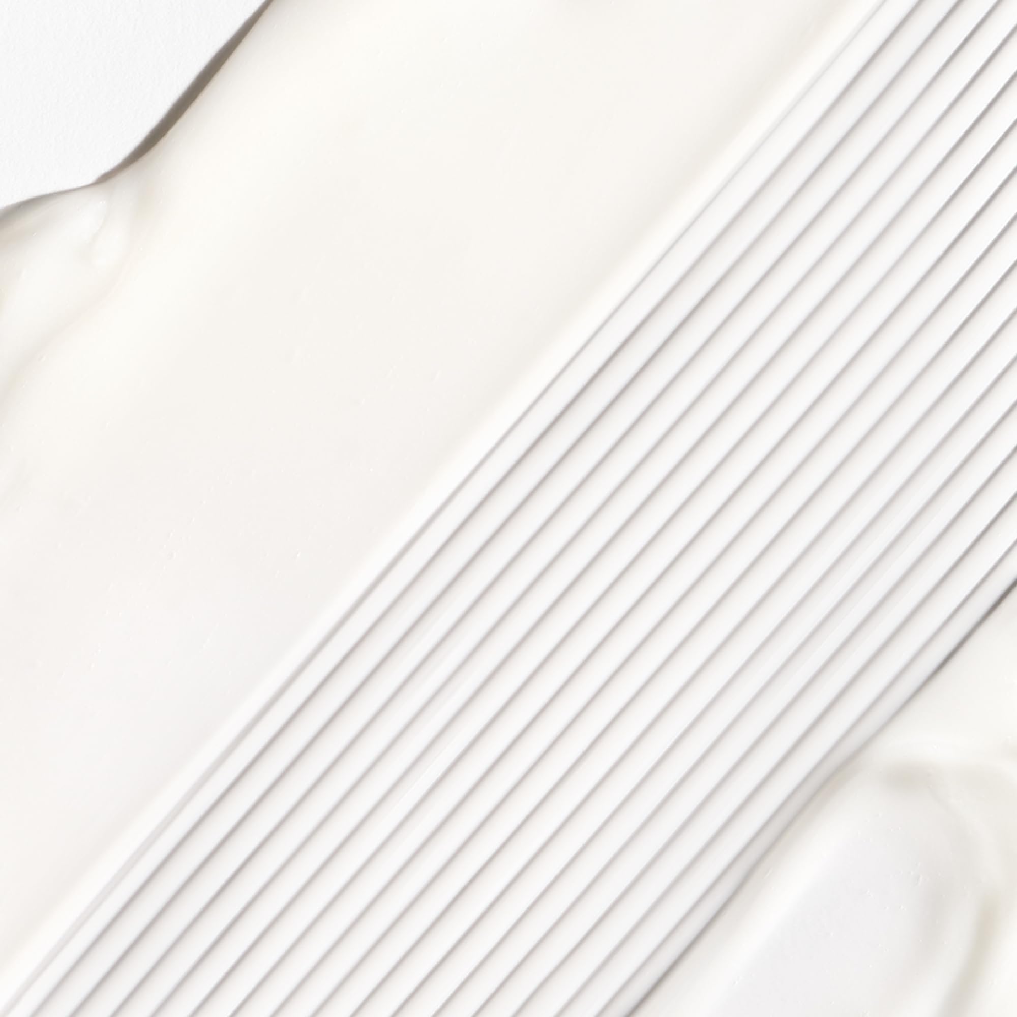 Briogeo Don't Despair Repair Mask applied to hair demonstrates even distribution.