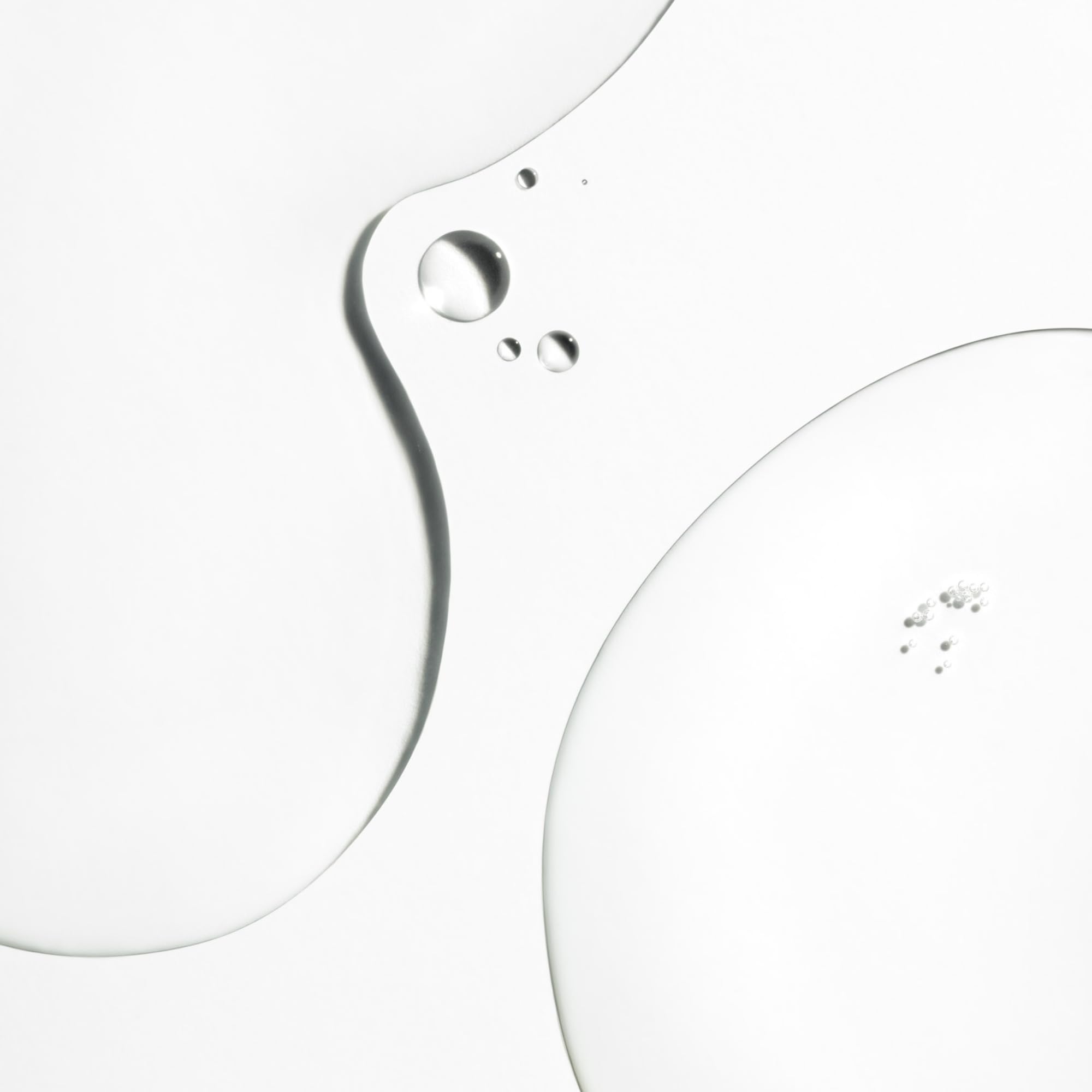 Briogeo Don't Despair, Repair! applying drops demonstrates customizable use for different hair densities