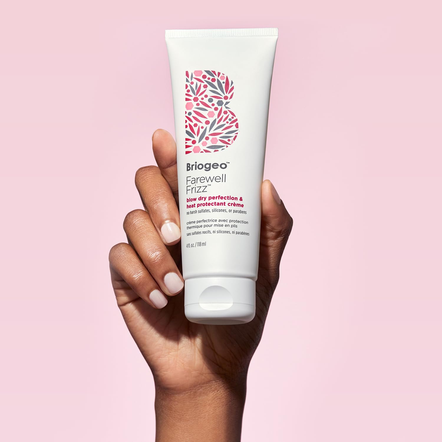 Briogeo Farewell Frizz cream texture close-up ready for even distribution.