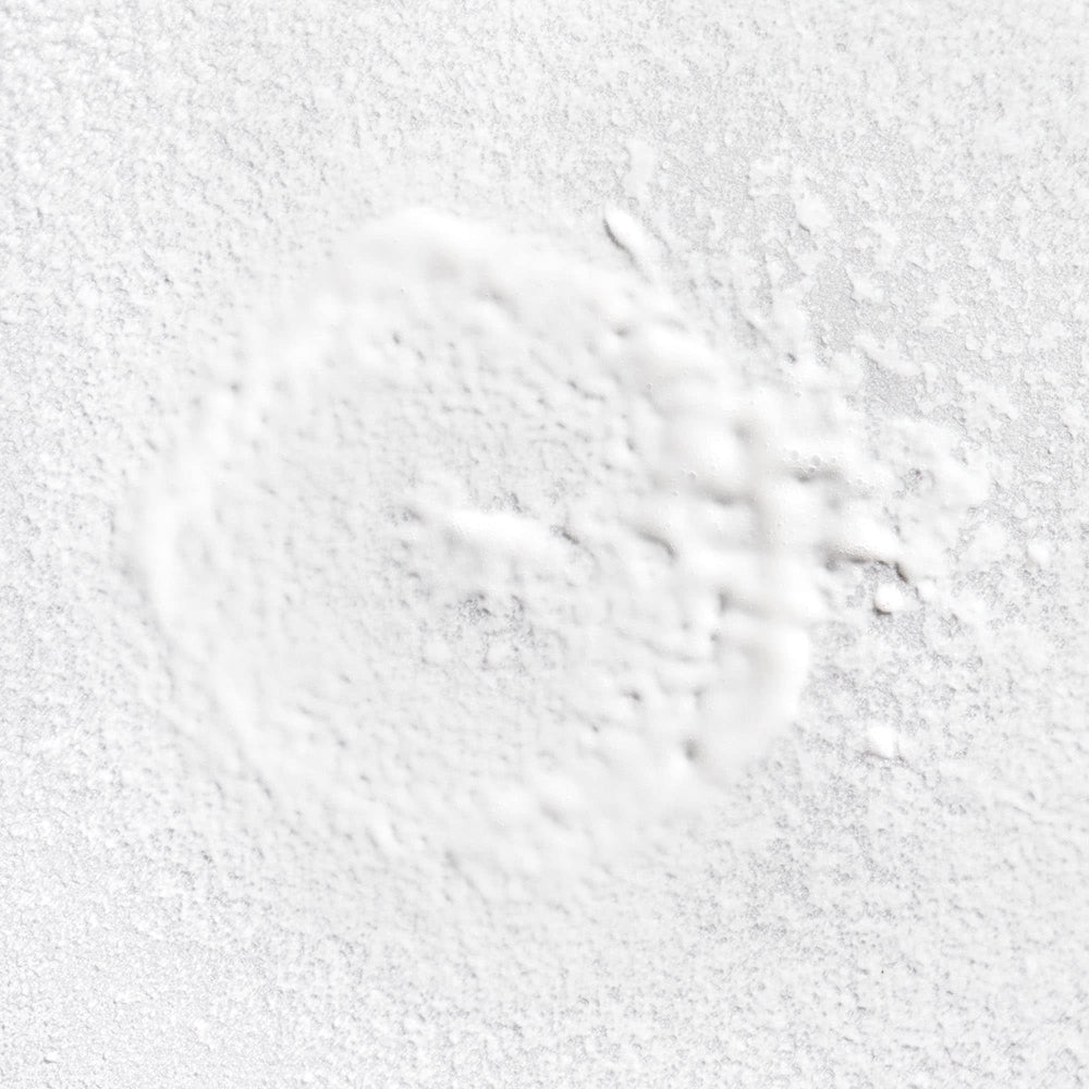 Rosarco Milk being applied for detangling moisture on damp curls