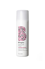 Briogeo Farewell Frizz Shampoo bottle demonstrates frizz control and shine.