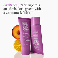 Applying Briogeo oil to dry hair to tame frizz and add shine