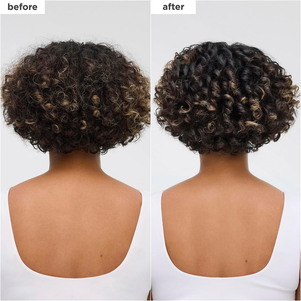 Applying Briogeo oil to wet hair for a smooth, glossy finish