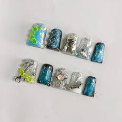BRKYKGK blue Gothic nails with rhinestones enhance any costume or event.