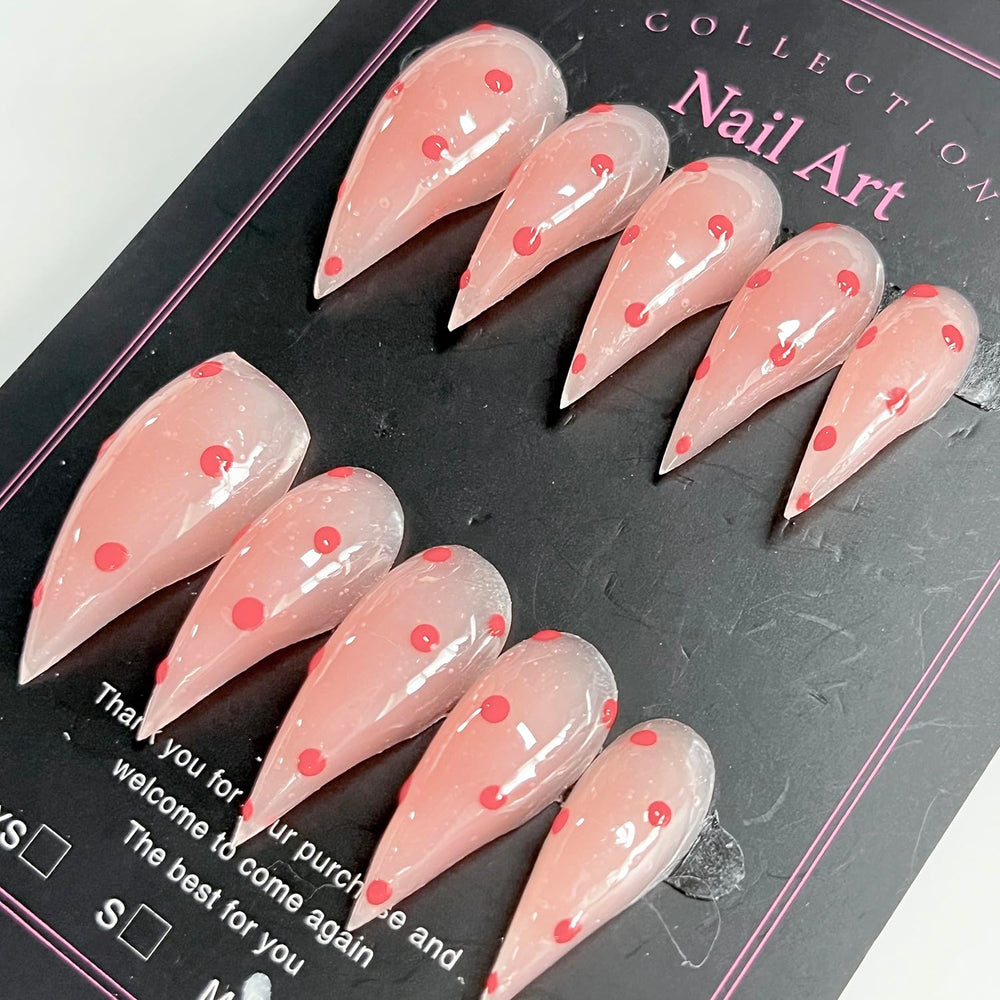 BRKYKGK nails with pink polka dots in a glossy finish for playful style.