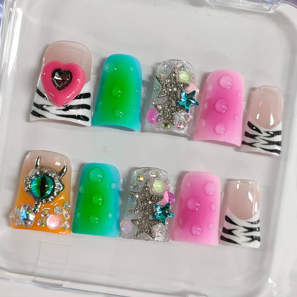 BRKYKGK nails featuring stars and rhinestones for festive style