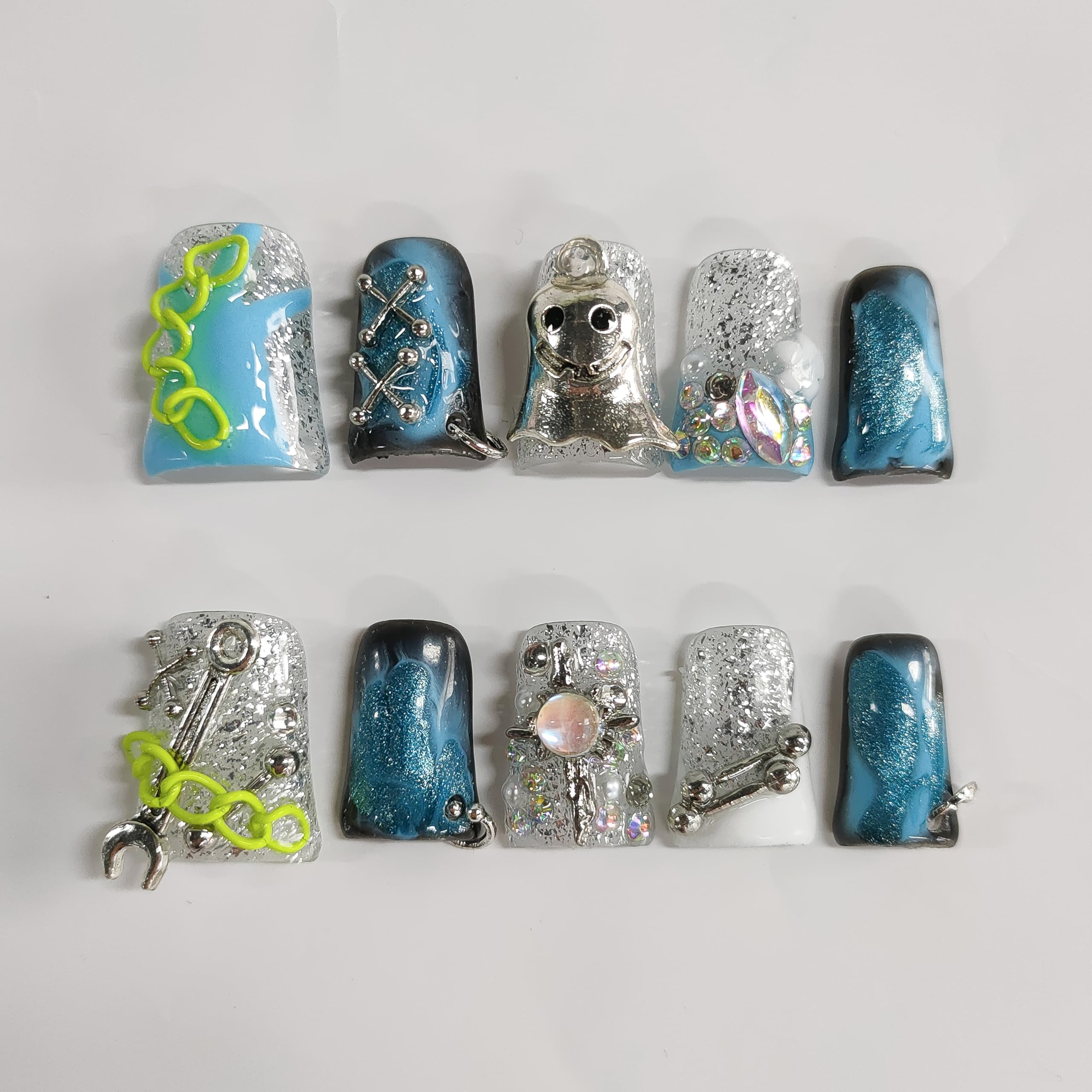 BRKYKGK short blue nails show glittery ghost accents for dramatic night wear.