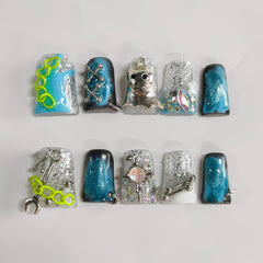 BRKYKGK short blue nails show glittery ghost accents for dramatic night wear.