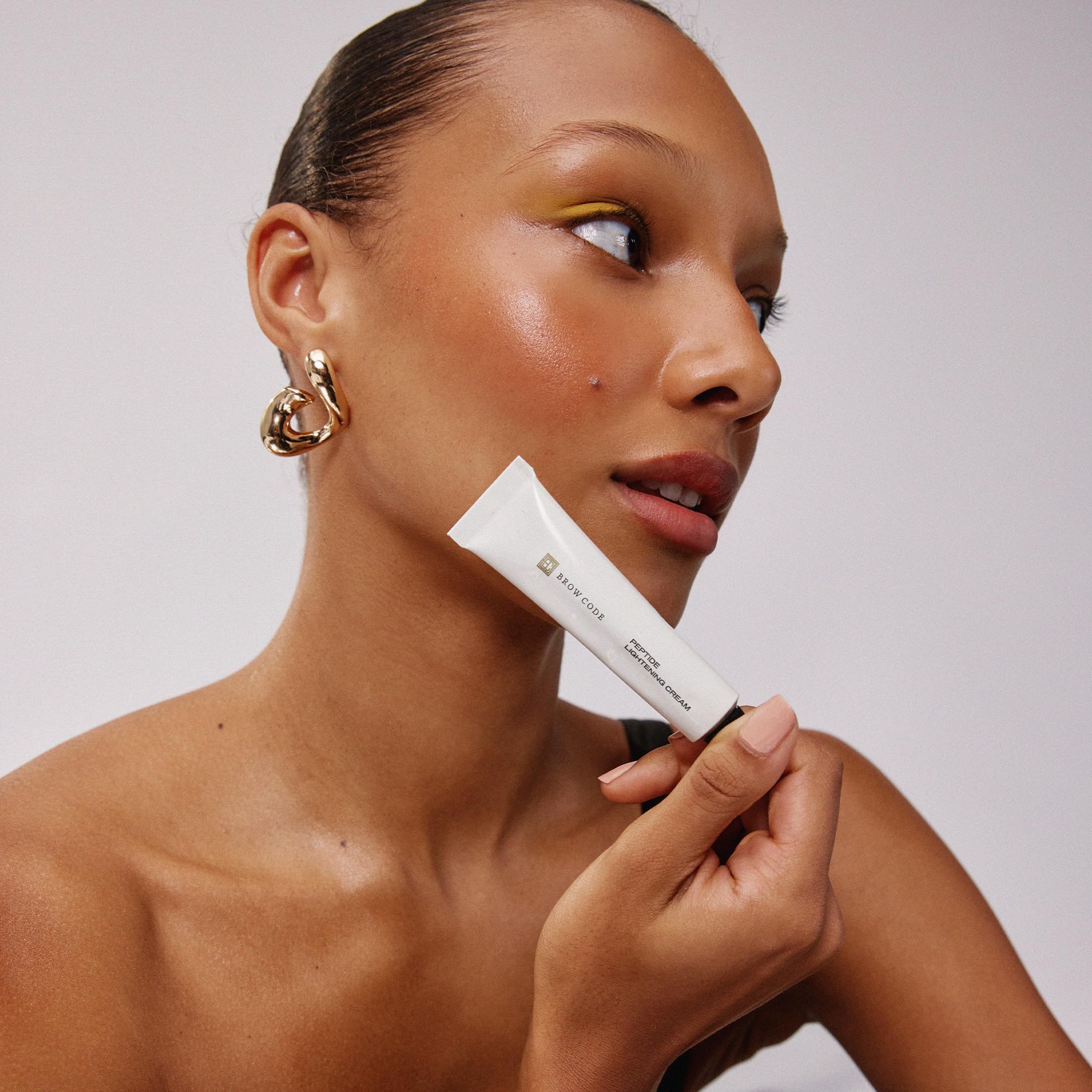 Peptide and pro-vitamin blend from Brow Code nourishes brows while you treat them.