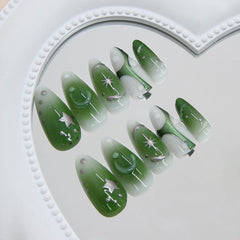 BSBTBZ glossy green nails with French tips and star details for quick glam