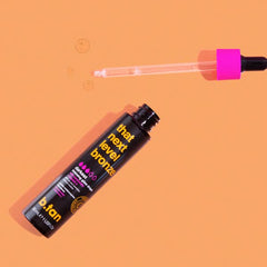 BTAN Dark Self Tan Drops being applied on face for natural bronze glow