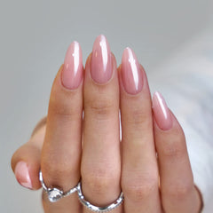 BTArtbox Almond Press On Nails with pink chrome and soft gel shine under light.
