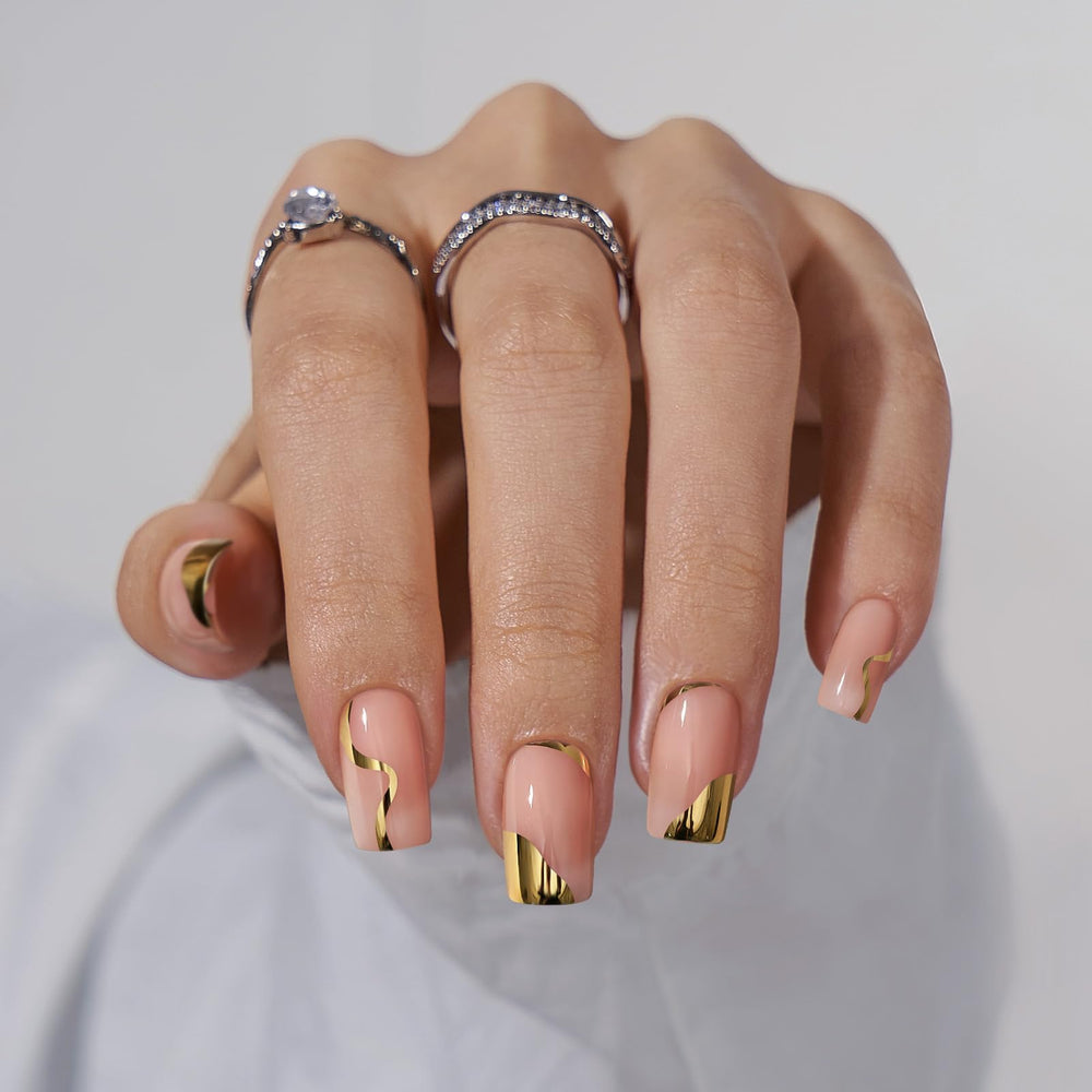 BTArtbox gold leaf short square nails with glossy gel finish.