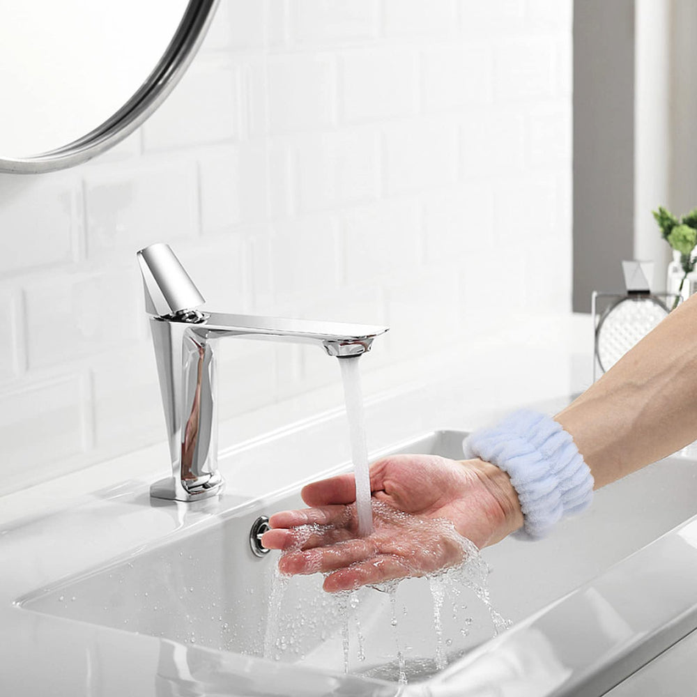 BTYMS face-wash routine wrist band in use during skincare.