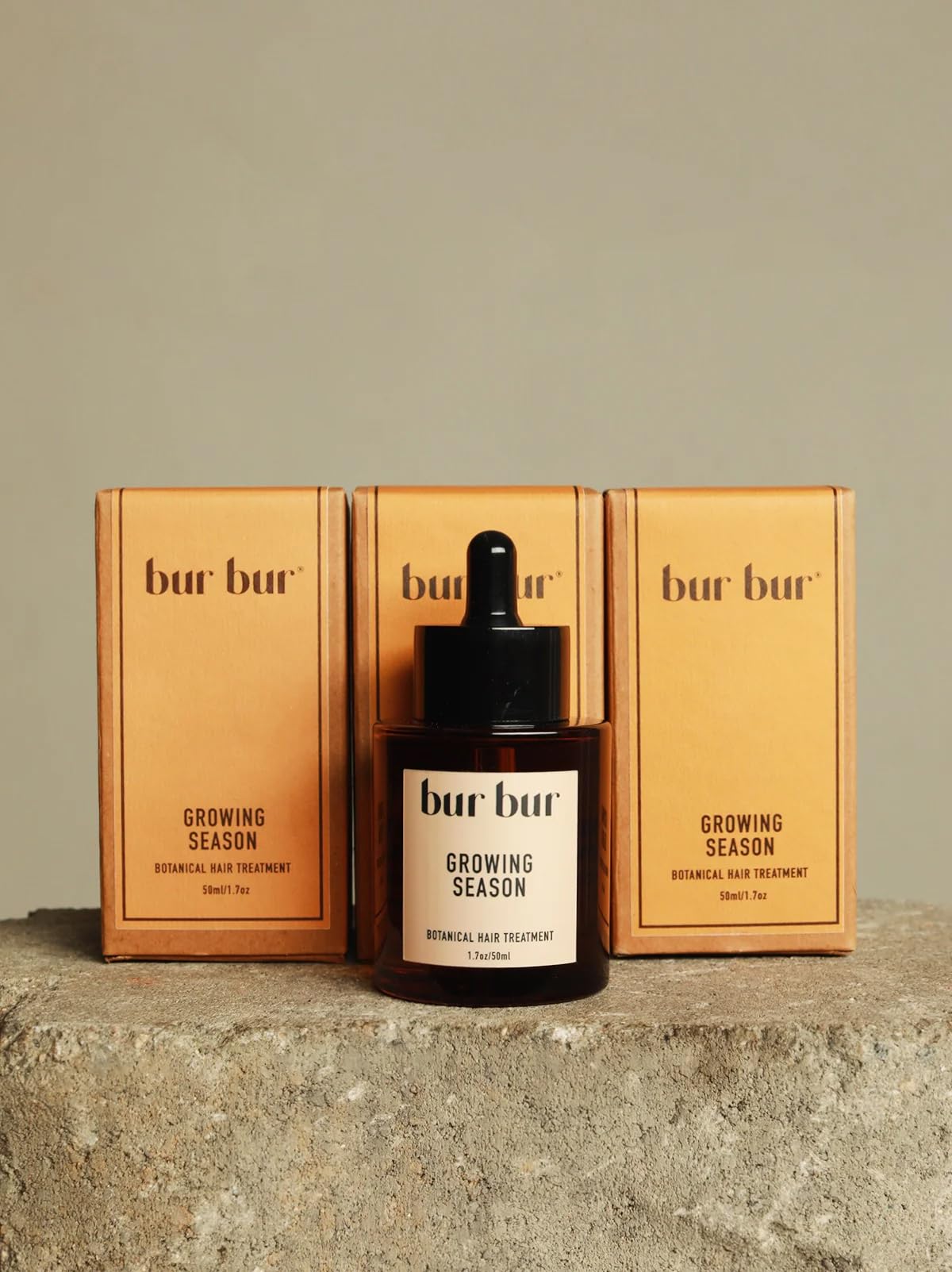 Bur Bur Growing Season oil bottle closeup showing nourishing formula for fuller hair