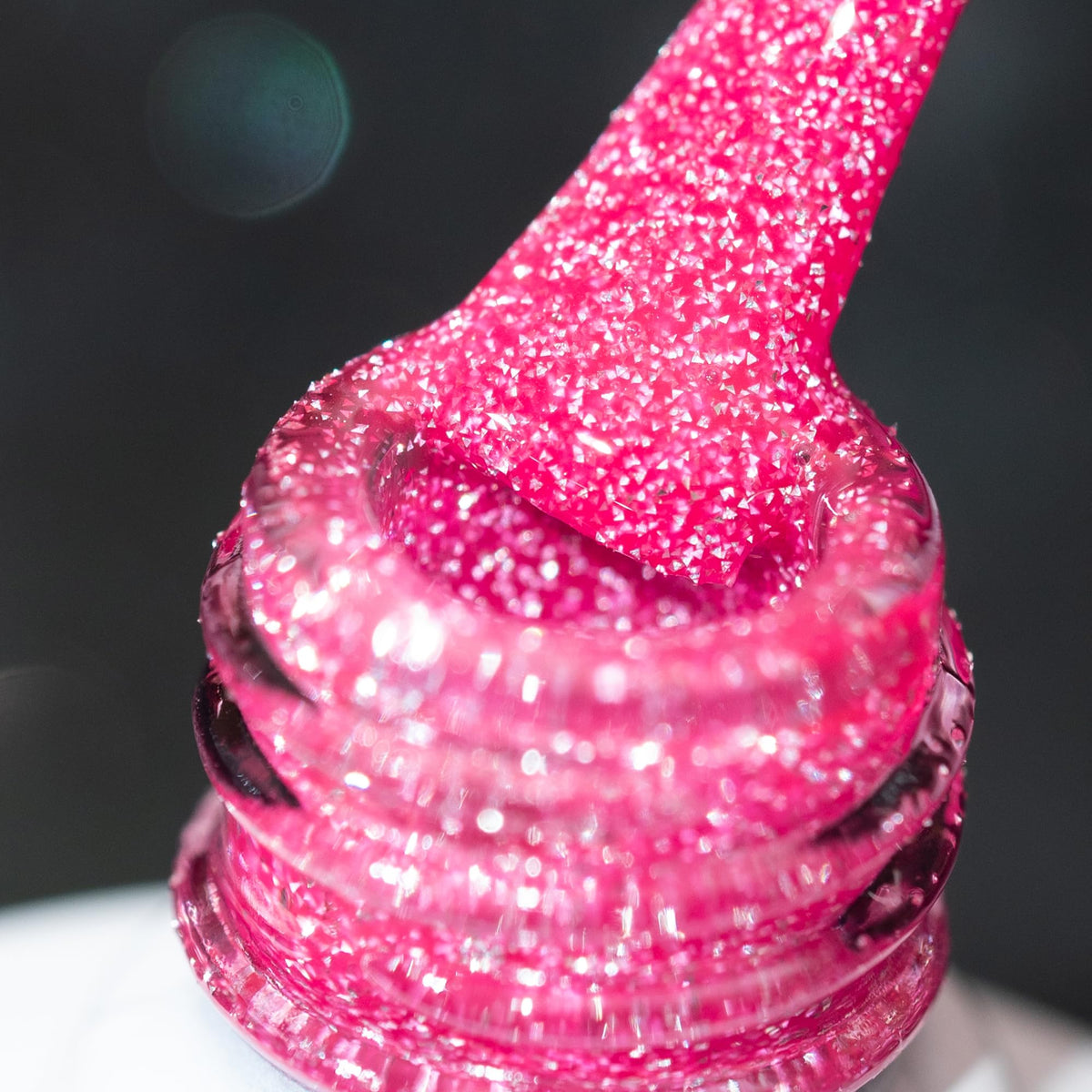 BURANO hot pink reflective glitter nail polish bottle for dramatic sparkle under lights.