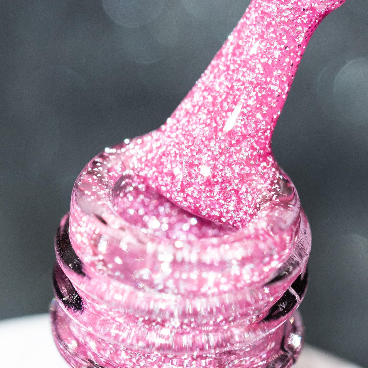 BURANO pink reflective glitter polish bottle with vivid sparkle for nails.