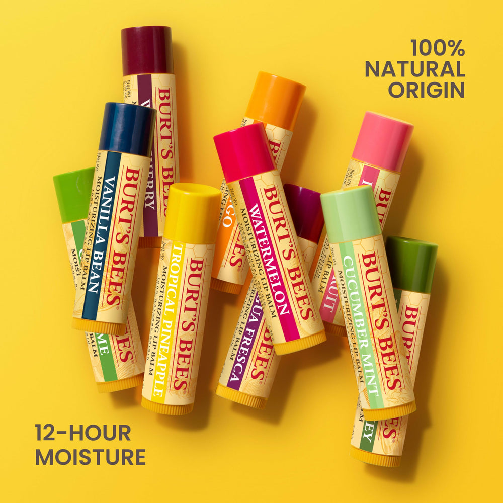 Applying cucumber mint Burt's Bees lip balm for quick refreshment.