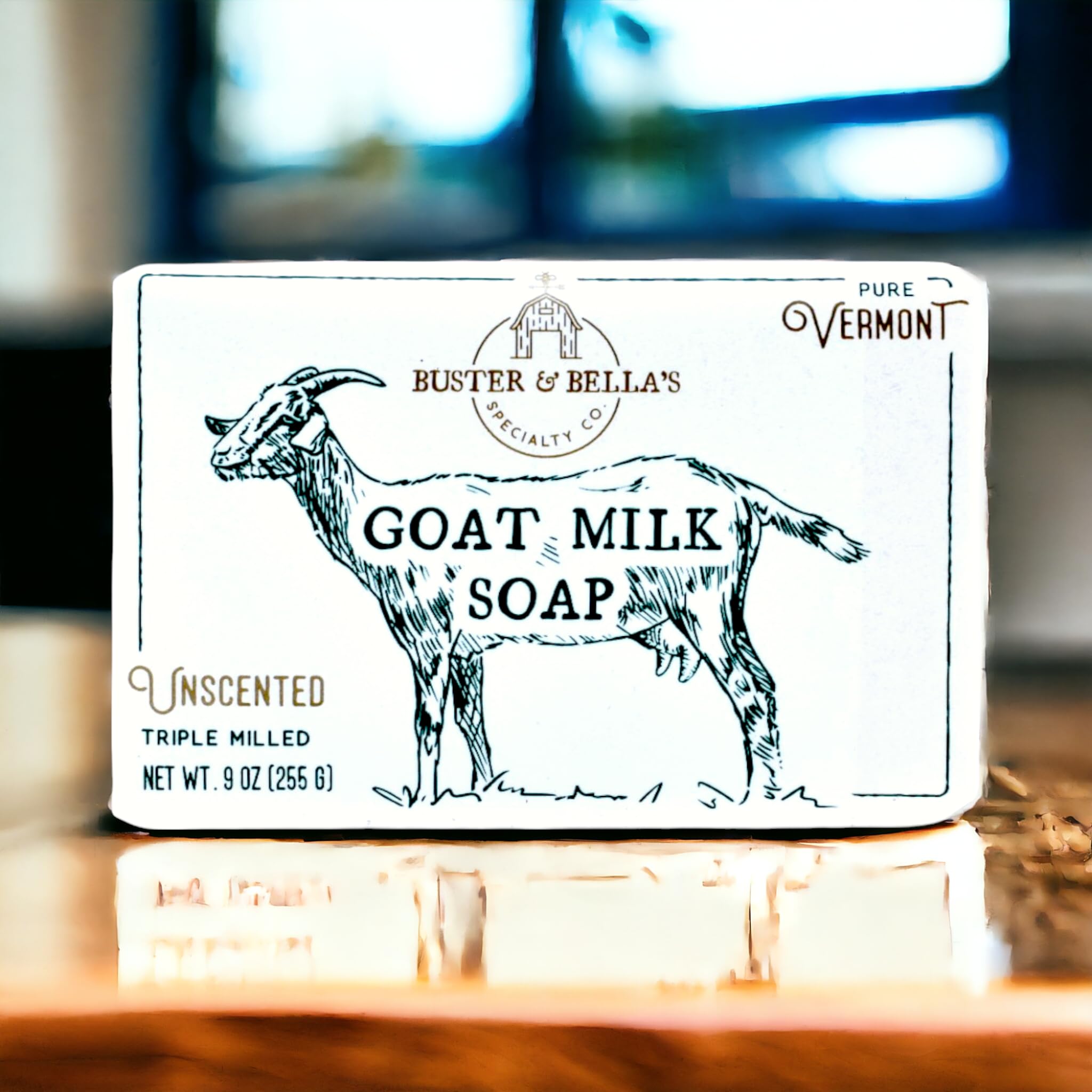 Buster & Bella's Unscented Goat Milk Soap under water droplets, highlighting fragrance-free cleansing.