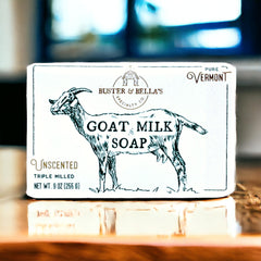 Buster & Bella's Unscented Goat Milk Soap under water droplets, highlighting fragrance-free cleansing.