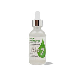 By Natures Bio7 Biotin Growth Drop bottle on a vanity, ready for scalp hydration.