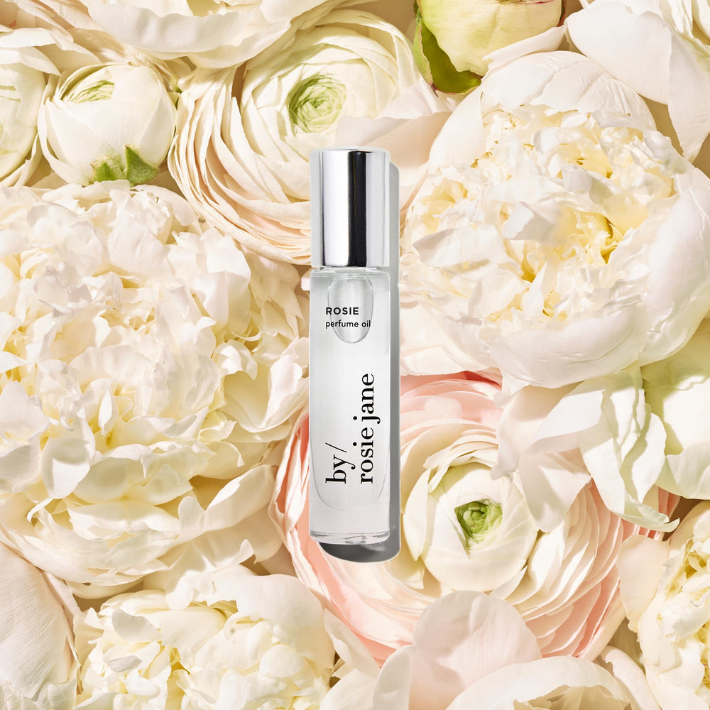 By Rosie Jane Rosie roll-on applied to pulse points for quick fragrance.
