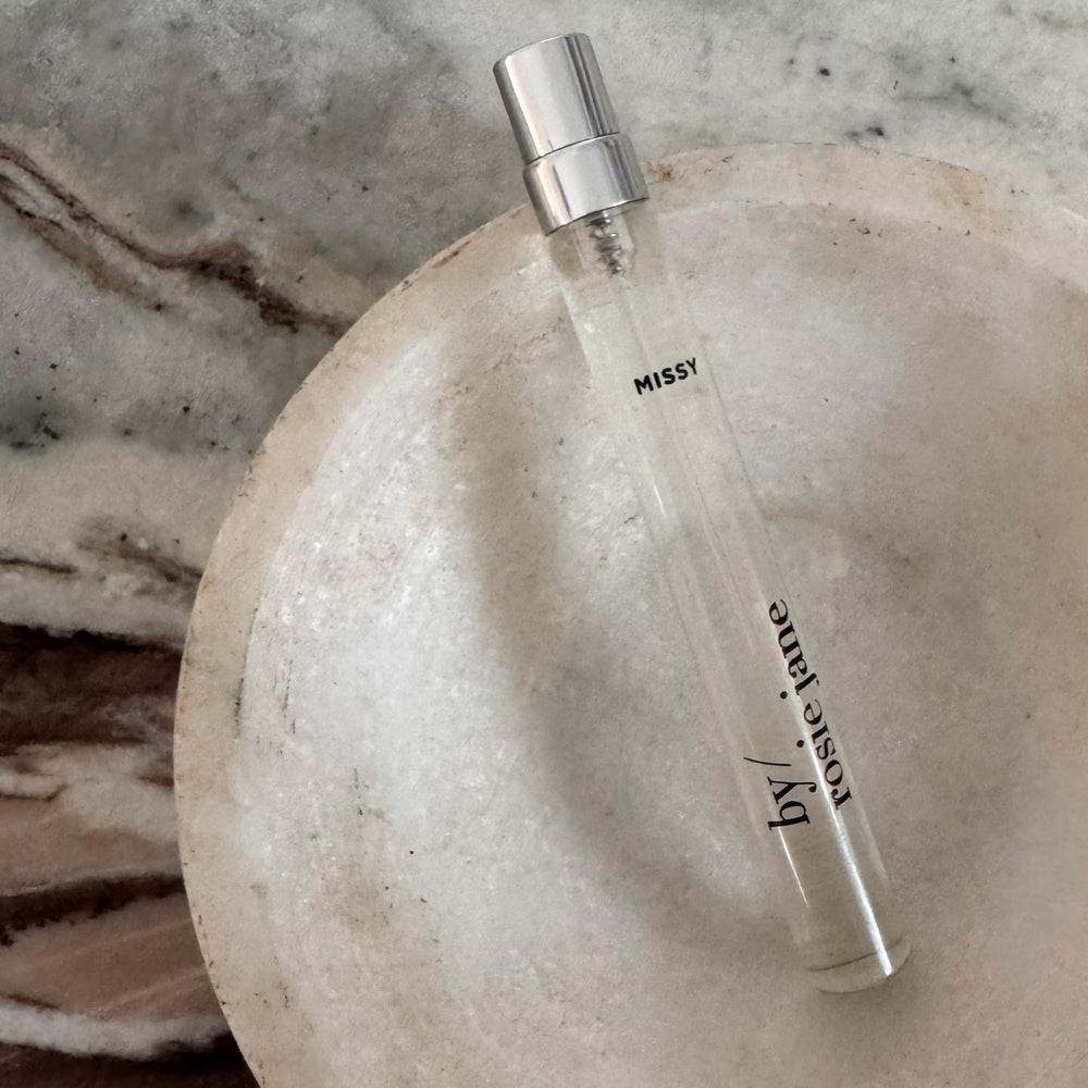Missy amber glass bottle communicates premium, travel-friendly packaging.